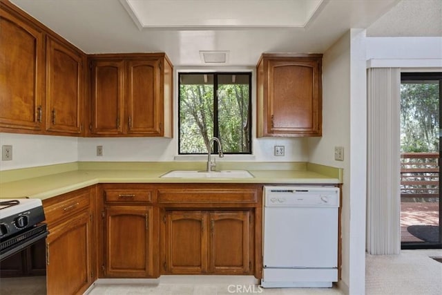 645 Worcester Dr, Cambria, CA 93428 - kitchen with white dishwasher, gas range oven, a sink, and light countertops