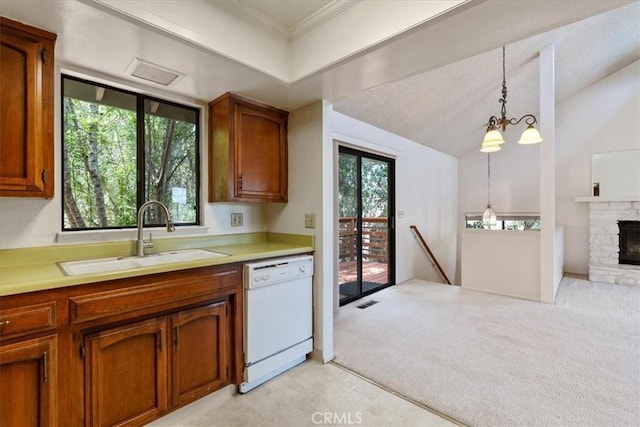 645 Worcester Dr, Cambria, CA 93428 - kitchen featuring dishwasher, a sink, brown cabinets, light countertops, and lofted ceiling
