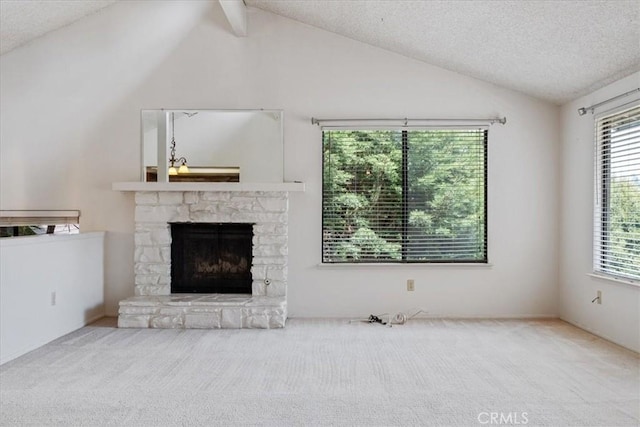 645 Worcester Dr, Cambria, CA 93428 - unfurnished living room with lofted ceiling, carpet floors, a fireplace, and a textured ceiling