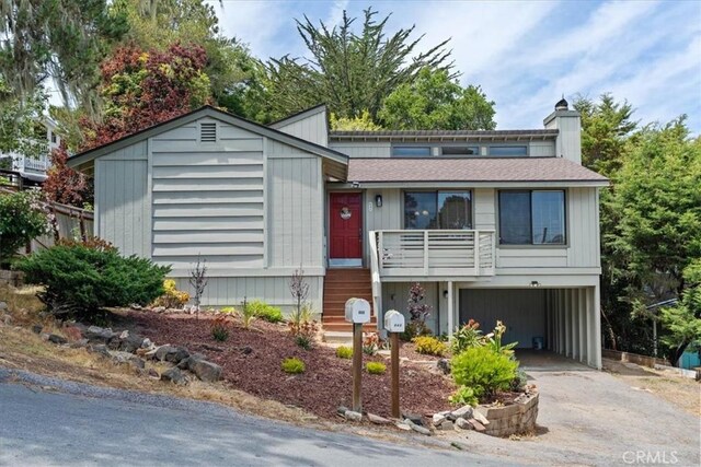 645 Worcester Dr, Cambria, CA 93428 - view of front of house with driveway, roof with shingles, and a chimney
