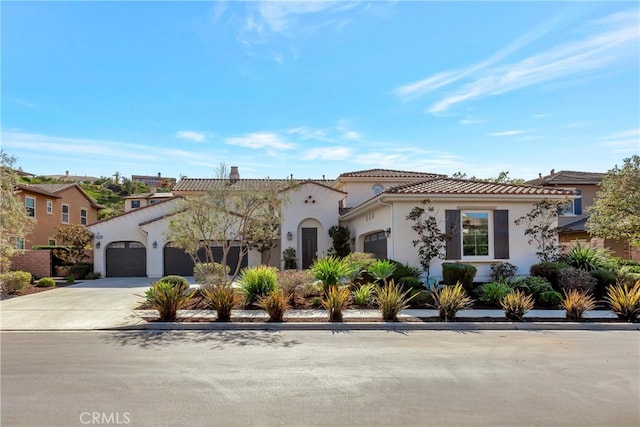 29310 Paseo Palmar, San Juan Capistrano, CA 92675 - mediterranean / spanish house with an attached garage, driveway, stucco siding, and a tile roof