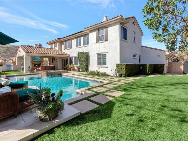 29310 Paseo Palmar, San Juan Capistrano, CA 92675 - back of house featuring a chimney, stucco siding, and a patio area