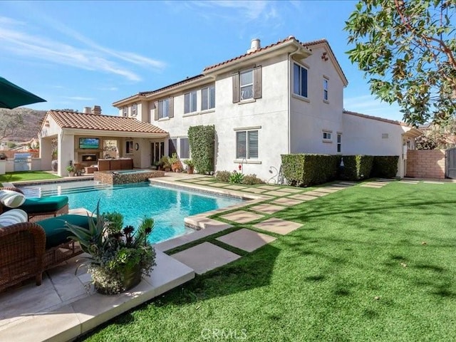 29310 Paseo Palmar, San Juan Capistrano, CA 92675 - rear view of property featuring a chimney, stucco siding, and a patio area
