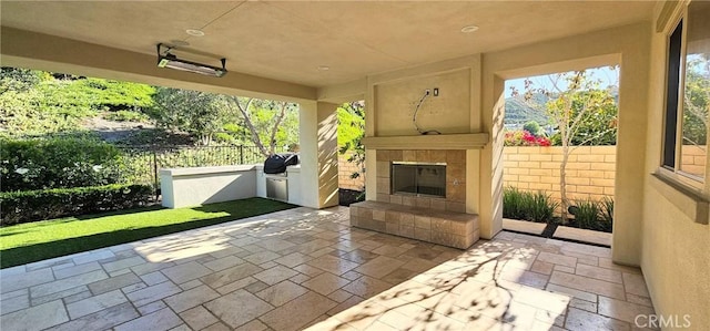 29310 Paseo Palmar, San Juan Capistrano, CA 92675 - view of patio with a tiled fireplace and area for grilling