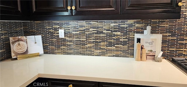 29310 Paseo Palmar, San Juan Capistrano, CA 92675 - kitchen view of tasteful backsplash, light countertops, and dark brown cabinets