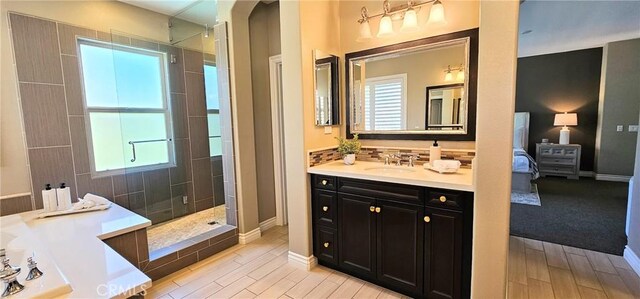 29310 Paseo Palmar, San Juan Capistrano, CA 92675 - full bathroom featuring a walk in shower, vanity, wood finished floors, a tub, and ensuite bath