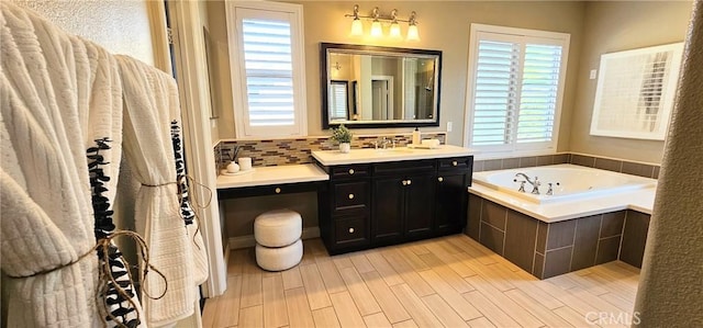 29310 Paseo Palmar, San Juan Capistrano, CA 92675 - bathroom featuring vanity, a garden tub, wood finished floors, and backsplash