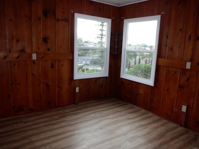 22432245 S Lanoitan, National City, CA 91950 - unfurnished room featuring wooden walls and light wood-style flooring