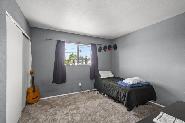 22432245 S Lanoitan, National City, CA 91950 - carpeted bedroom with a closet and a textured ceiling