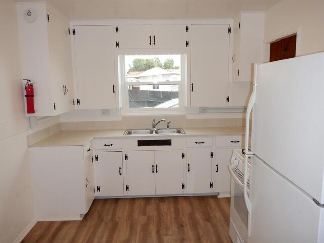 22432245 S Lanoitan, National City, CA 91950 - kitchen featuring white appliances, a sink, wood finished floors, white cabinetry, and light countertops