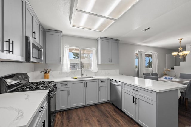 22432245 S Lanoitan, National City, CA 91950 - kitchen with appliances with stainless steel finishes, a peninsula, a sink, and gray cabinetry