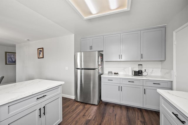 22432245 S Lanoitan, National City, CA 91950 - kitchen featuring freestanding refrigerator, dark wood finished floors, light stone countertops, and baseboards