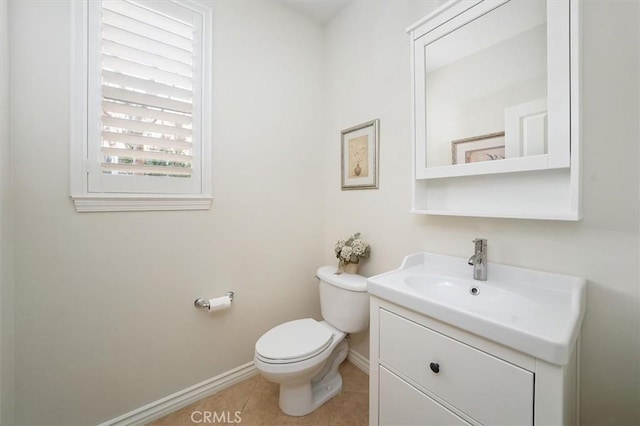 19728 Ellis Henry Ct, Newhall, CA 91321 - half bathroom with vanity, baseboards, toilet, and tile patterned floors