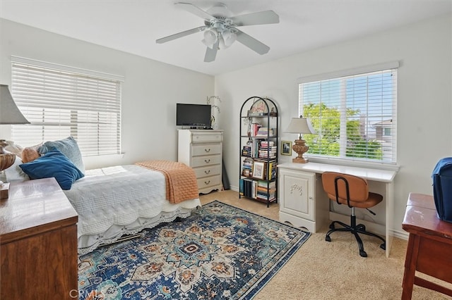 19728 Ellis Henry Ct, Newhall, CA 91321 - bedroom with light carpet, a desk, a ceiling fan, and baseboards