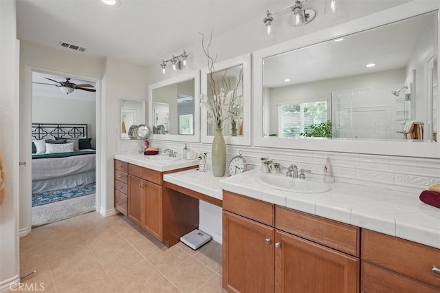19728 Ellis Henry Ct, Newhall, CA 91321 - full bath with connected bathroom, vanity, a shower stall, ceiling fan, and tile patterned floors