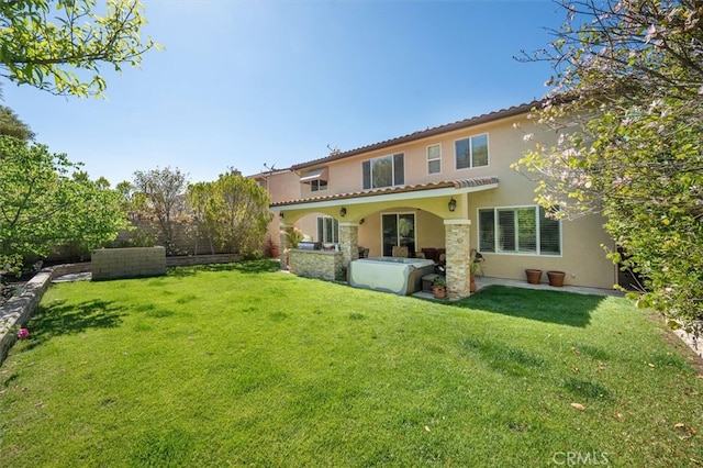 19728 Ellis Henry Ct, Newhall, CA 91321 - back of property featuring stucco siding, a yard, and a tiled roof