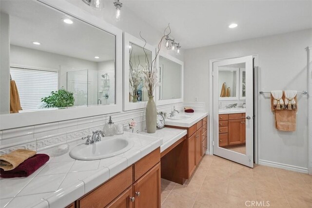 19728 Ellis Henry Ct, Newhall, CA 91321 - full bath featuring two vanities, a shower stall, tile patterned flooring, and recessed lighting