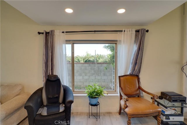 12076 Racket Ct, Moreno Valley, CA 92557 - sitting room with wood finished floors, recessed lighting, and baseboards