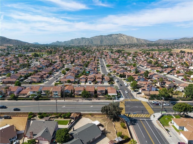 12076 Racket Ct, Moreno Valley, CA 92557 - aerial overview of property's location featuring nearby suburban area and a mountain backdrop