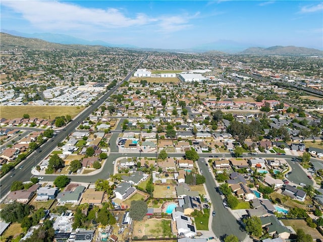 12076 Racket Ct, Moreno Valley, CA 92557 - aerial view of property's location with a mountain backdrop and nearby suburban area