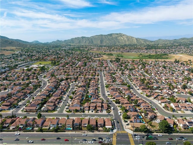 12076 Racket Ct, Moreno Valley, CA 92557 - aerial overview of property's location featuring a mountainous background and nearby suburban area