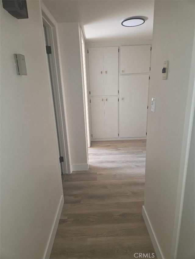1512 Forane, Barstow, CA 92311 - hallway featuring light wood-style floors and baseboards