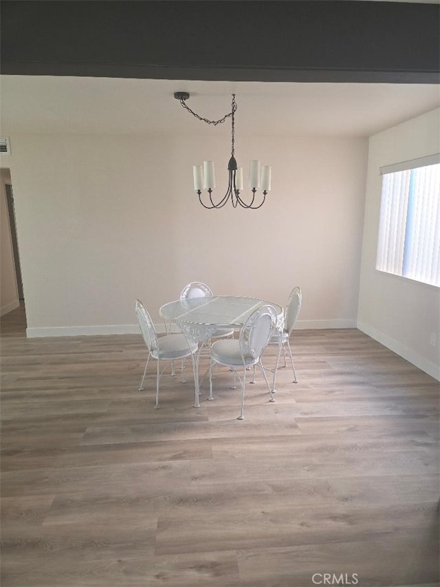 1512 Forane, Barstow, CA 92311 - dining space with a chandelier, baseboards, and light wood-style floors