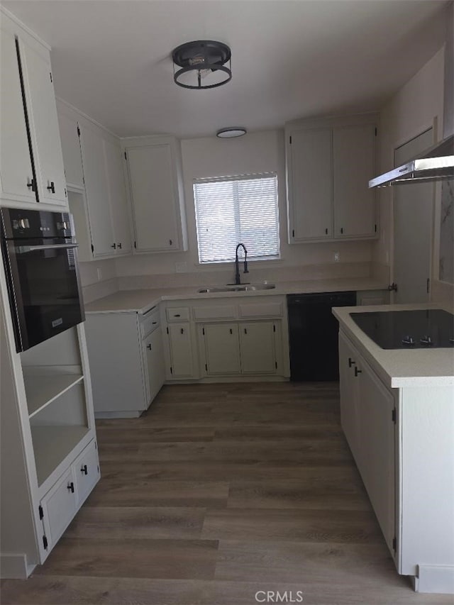 1512 Forane, Barstow, CA 92311 - kitchen featuring black appliances, a sink, wood finished floors, and light countertops