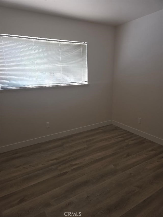 1512 Forane, Barstow, CA 92311 - spare room featuring dark wood-style floors and baseboards