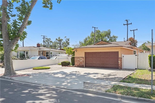 2006 W 180th Pl, Torrance, CA 90504 - single story home with an attached garage, concrete driveway, stucco siding, and a gate