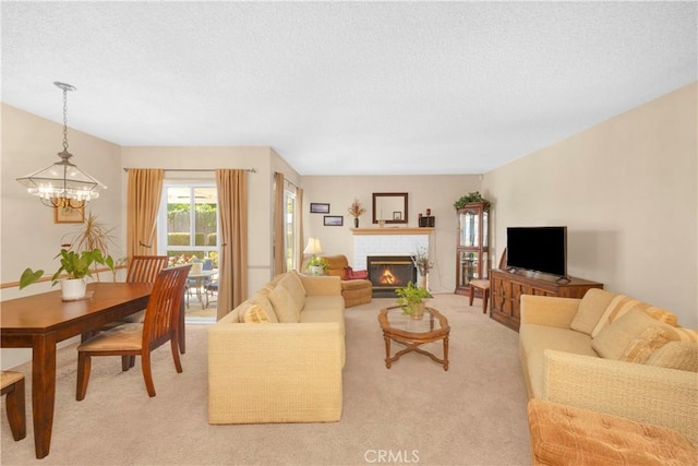 2006 W 180th Pl, Torrance, CA 90504 - living area with a chandelier, light colored carpet, a textured ceiling, and a brick fireplace