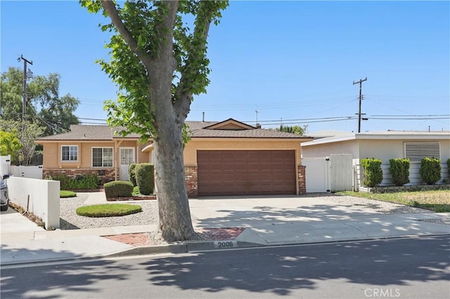 2006 W 180th Pl, Torrance, CA 90504 - single story home with stucco siding, a gate, driveway, a garage, and stone siding