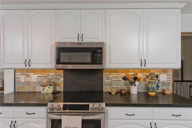 23328 Valley Circle Blvd, Chatsworth, CA 91311 - kitchen featuring stainless steel appliances, dark countertops, and backsplash