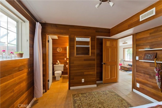 23328 Valley Circle Blvd, Chatsworth, CA 91311 - corridor with wooden walls and light tile patterned flooring