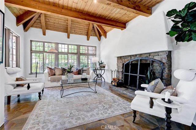 2917 N Poinsettia Ave, Manhattan Beach, CA 90266 - living area featuring wooden ceiling with exposed beams, a stone fireplace, stone finish flooring, and high vaulted ceiling
