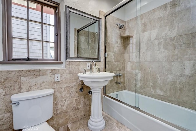 2917 N Poinsettia Ave, Manhattan Beach, CA 90266 - bathroom featuring toilet, healthy amount of natural light, enclosed tub / shower combo, and tile walls