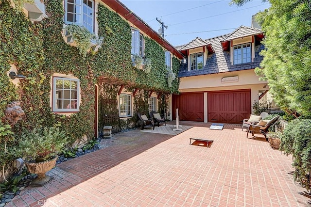 2917 N Poinsettia Ave, Manhattan Beach, CA 90266 - back of house with an attached garage and stucco siding