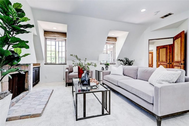 2917 N Poinsettia Ave, Manhattan Beach, CA 90266 - living room featuring healthy amount of natural light, light colored carpet, recessed lighting, and a fireplace with raised hearth