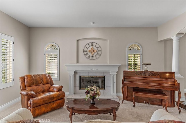 1459 W Quince Ct, Ontario, CA 91762 - living room featuring light carpet, ornate columns, a fireplace, and baseboards