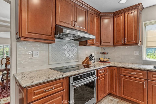 1459 W Quince Ct, Ontario, CA 91762 - kitchen with stainless steel oven, black electric stovetop, under cabinet range hood, and plenty of natural light
