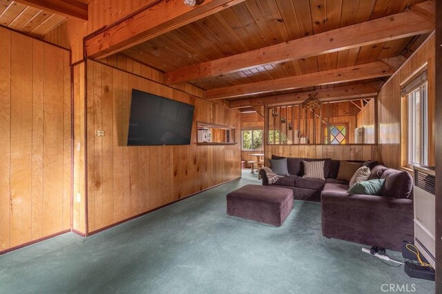43387 Sheephorn Rd, Big Bear Lake, CA 92315 - carpeted living area featuring wood walls and wood ceiling with exposed beams