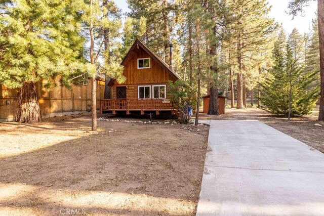 43387 Sheephorn Rd, Big Bear Lake, CA 92315 - view of front facade with a wooden deck and an outdoor structure