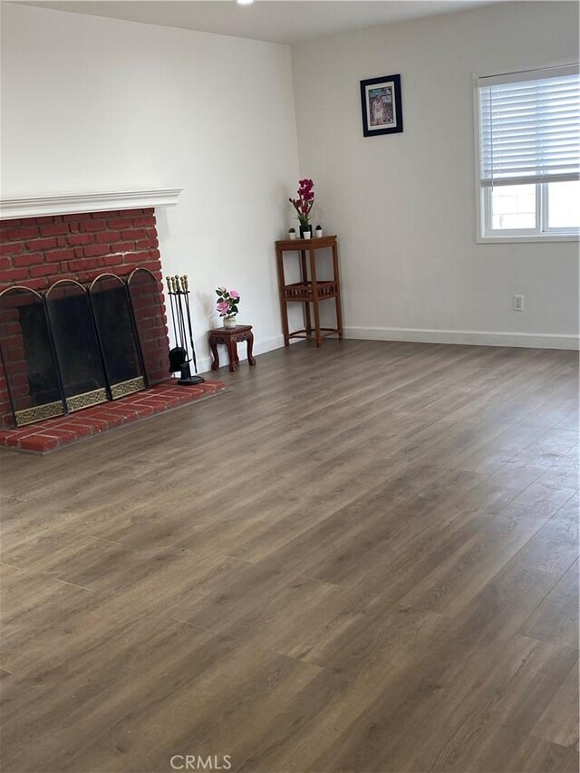 1442 W 220th St, Torrance, CA 90501 - living room featuring wood finished floors, baseboards, and a brick fireplace
