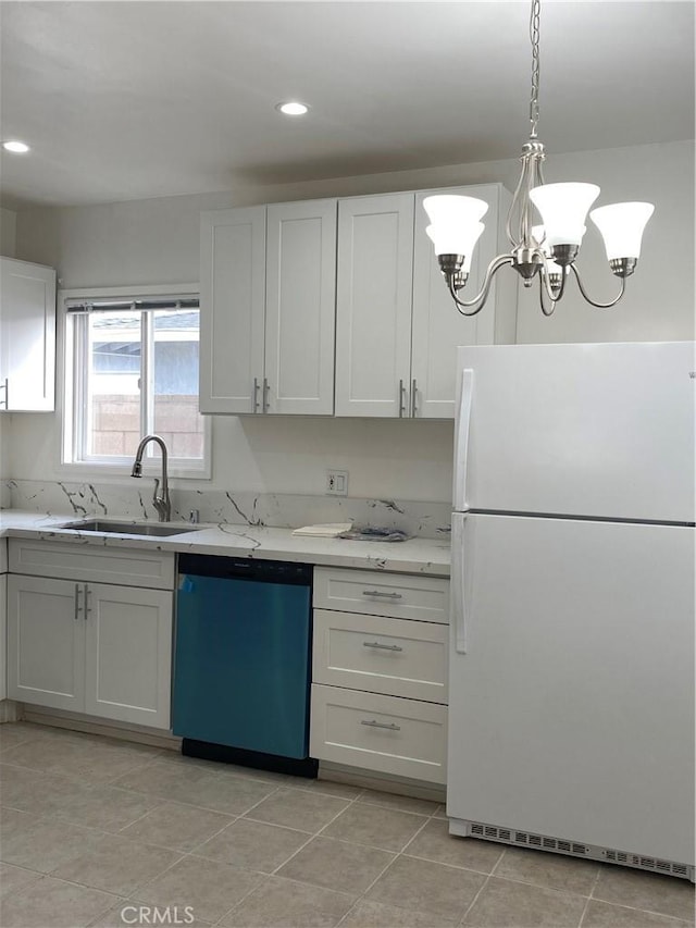 1442 W 220th St, Torrance, CA 90501 - kitchen with freestanding refrigerator, dishwashing machine, a sink, light stone countertops, and white cabinets