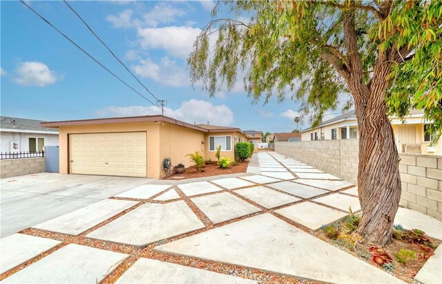 1442 W 220th St, Torrance, CA 90501 - view of front of home featuring stucco siding, a garage, and concrete driveway