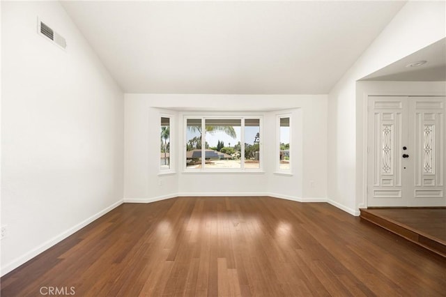 16481 Valle Vista Way, Riverside, CA 92506 - empty room featuring baseboards, wood finished floors, and lofted ceiling