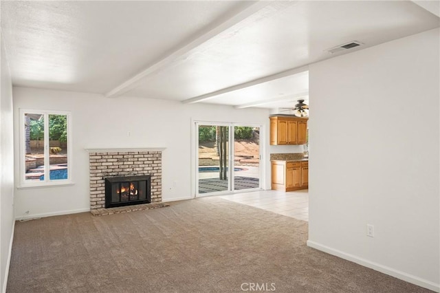 16481 Valle Vista Way, Riverside, CA 92506 - unfurnished living room with light colored carpet, beam ceiling, baseboards, a fireplace, and a ceiling fan