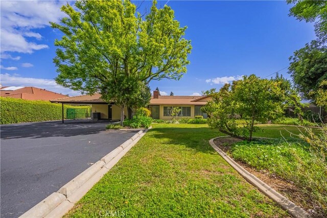 2445 Ocean View Dr, Upland, CA 91784 - view of front of property featuring a front yard, asphalt driveway, and a carport