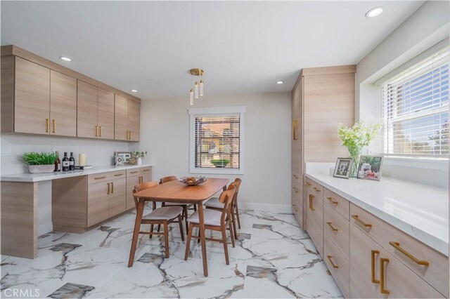 2445 Ocean View Dr, Upland, CA 91784 - kitchen with light marble finish flooring, recessed lighting, light brown cabinets, and light countertops