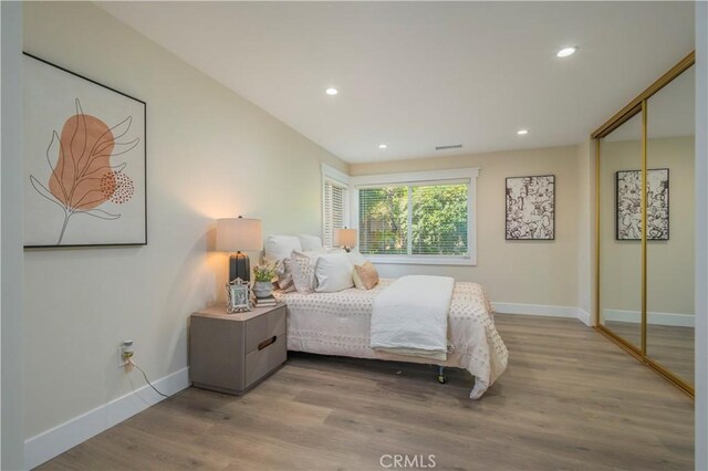 2445 Ocean View Dr, Upland, CA 91784 - bedroom featuring baseboards, wood finished floors, recessed lighting, and a closet